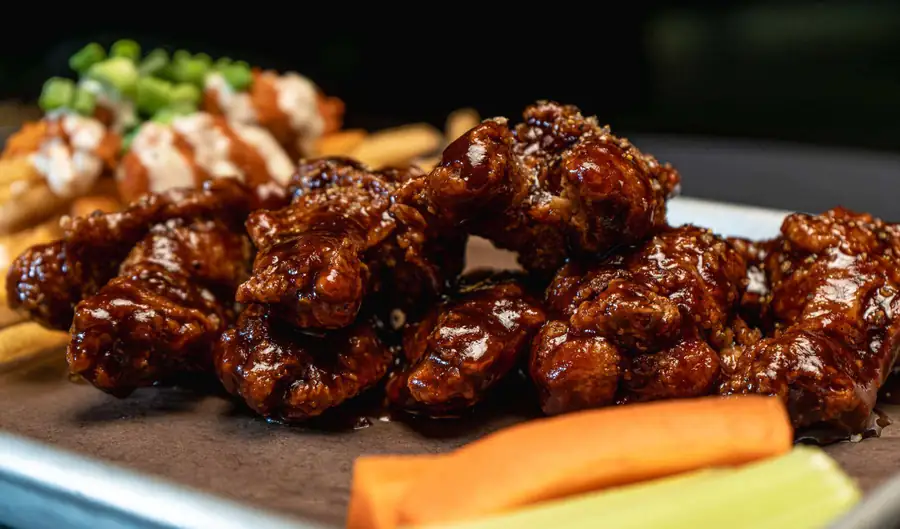 Sauced chicken wings and sides at Eddie's Restaurant